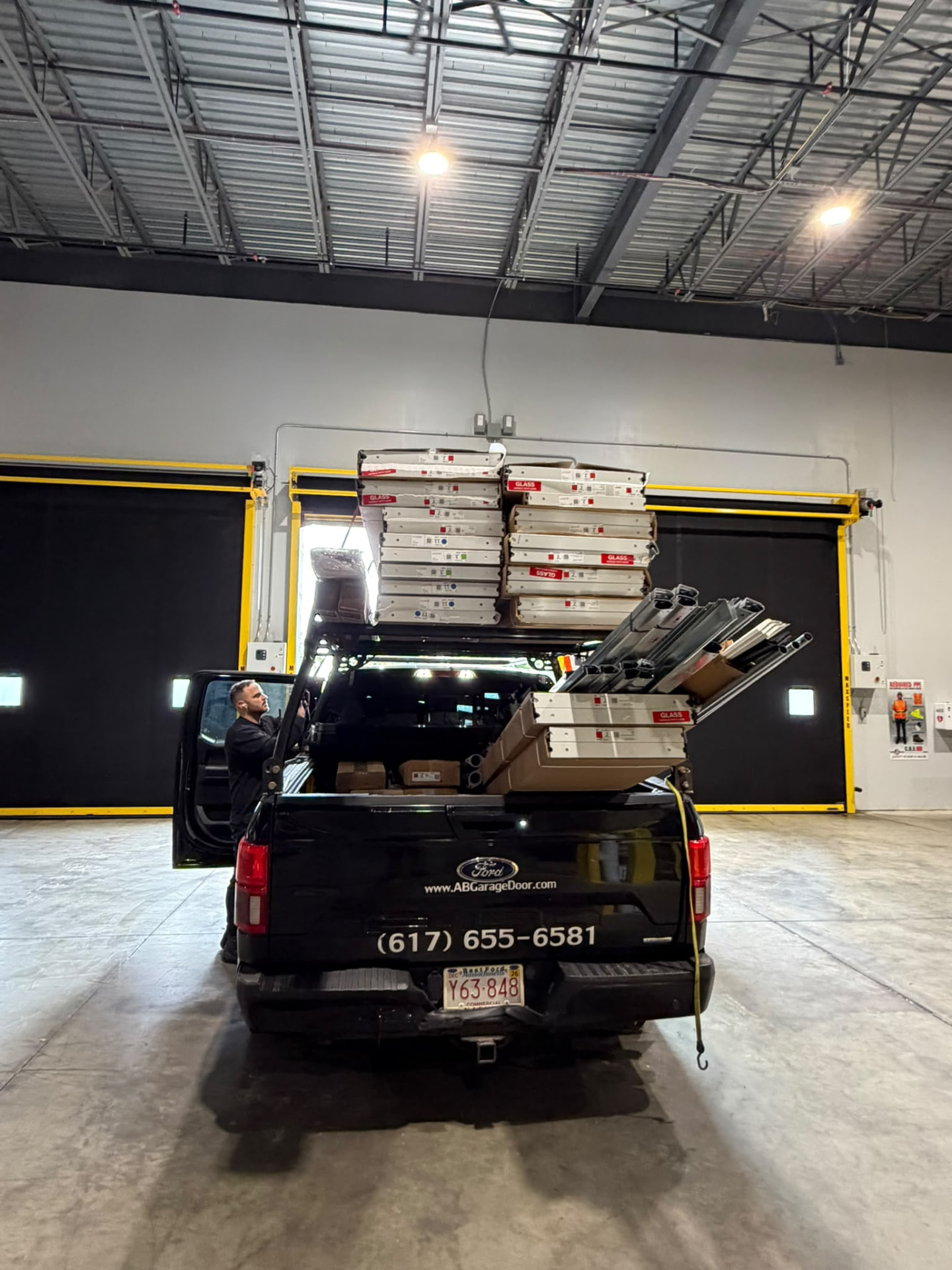 AB Garage Door truck loaded with door panels and tracks